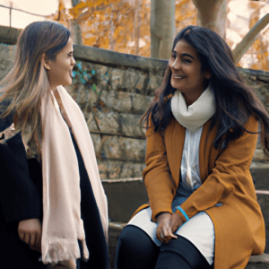 Real photos of two women talking and looking happy. No text in the photos. Make them look like real photos.